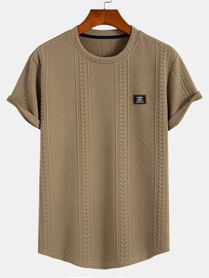 Kortärmad geometrisk jacquard-t-shirt med rundad nederkant