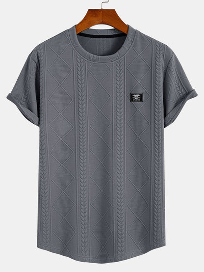 Kortärmad geometrisk jacquard-t-shirt med rundad nederkant
