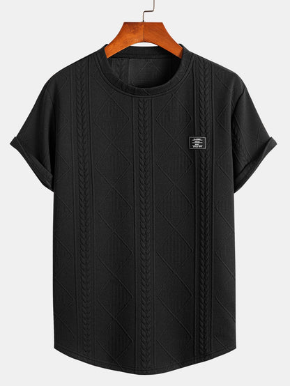 Kortärmad geometrisk jacquard-t-shirt med rundad nederkant