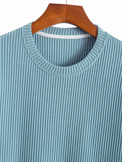 Stickad våfflad t-shirt med rundad nederkant
